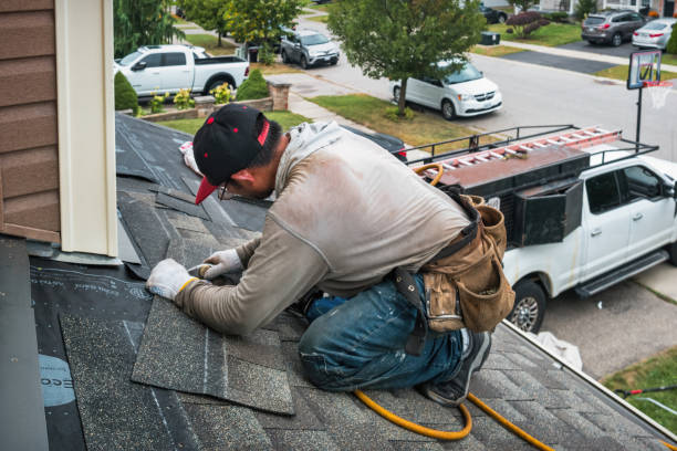 Professional Roofing technician working in Wayland, MA